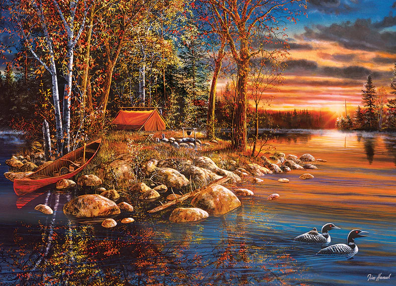 Casse-tête Cobble Hill 1000 pièces – Réveil – Illustration de Jim Hansel représentant un lever de soleil automnal au bord d’un lac, avec huards, forêt dorée et reflets paisibles sur l’eau.