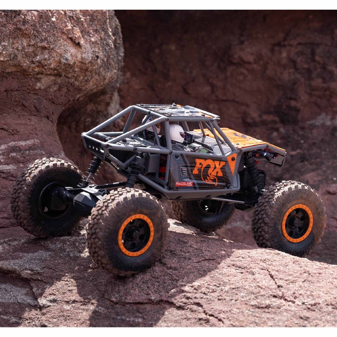 Axial UTB18 Capra 4WD 1/18 RTR – Modèle Orange – ponts portiques, châssis tubulaire – batterie Smart G2 & chargeur inclus – AXI01002V2 – Dernier modèle, discontinué – Univers RcLoisirs