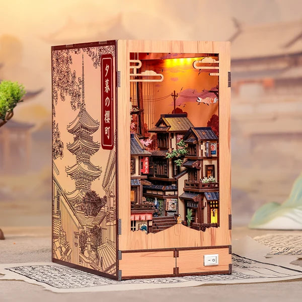 BJAA402 Twilight Sakura Path, Book Nook DIY de 407 pieces inspire des rues de Kyoto avec cerisiers en fleurs, eclairage DEL et decor japonais detaille.
