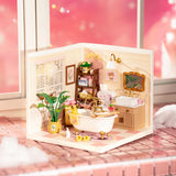 Rolife Pop Bubble (DW014B) – miniature “bathroom” à assembler. Env. 16,3×16,3×15,2 cm montée, 103 pièces, ~45 min d’assemblage. Idéal déco créative/collection.