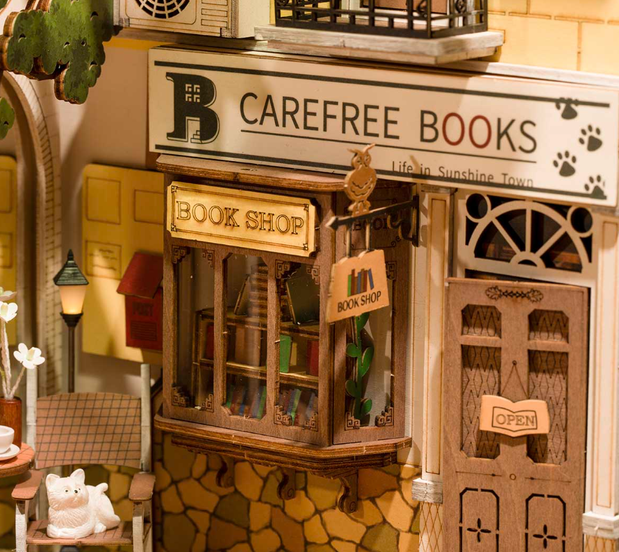 Rolife Sunshine Town (TGB02) – Book Nook miniature à assembler. Taille montée env. 18,5×10×24,2 cm, kit créatif décoratif avec éclairage.